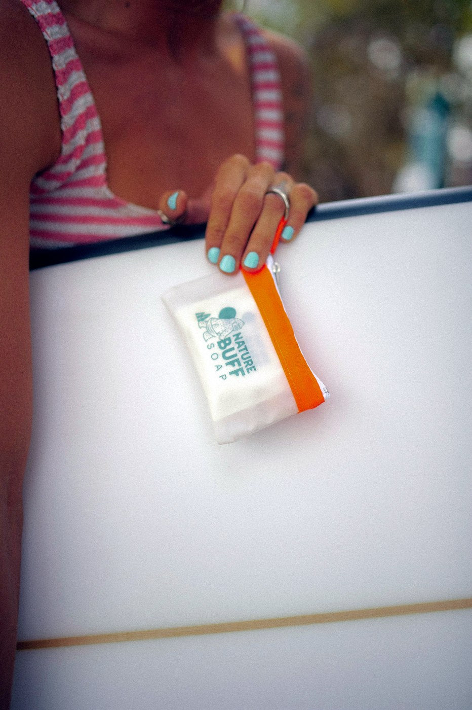Mighty Mini pouch with Buff Bar soap during an outdoor water bottle wash
