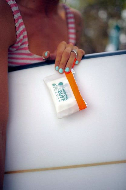 Mighty Mini pouch with Buff Bar soap during an outdoor water bottle wash